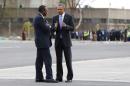 Obama walks with Kenyatta as he departs for Ethiopia aboard Air Force One from Jomo Kenyatta International Airport in Nairobi