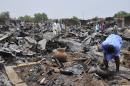 A trader washes his hands on May 11, 2014 at Gamboru market, burned by suspected Boko Haram insurgents