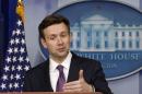 Josh Earnest answers questions at the White House in Washington