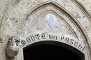 The Monte dei Paschi bank logo is seen on the main entrance of the bank's headquarters in Siena