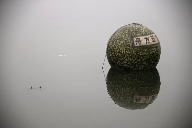 A spherical pod, named "Noah's Ark", designed by Chinese inventor Liu Qiyuan floats on a river during a test in Xianghe