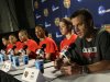 Louisville head coach Jeff Walz, right, and his players talk during a news conference for the women's NCAA Final Four college basketball tournament final, Monday, April 8, 2013, in New Orleans. Louisville plays Connecticut in the championship game on Tuesday.  (AP Photo/Dave Martin)