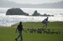 Phil Mickelson walks to the 17th green of the Pebble Beach Golf Links during the third round of the AT&T Pebble Beach National Pro-Am golf tournament Saturday, Feb. 13, 2016, in Pebble Beach, Calif. (AP Photo/Eric Risberg)