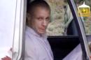 In this image taken from video obtained from Voice Of Jihad Website, which has been authenticated based on its contents and other AP reporting, Sgt. Bowe Bergdahl sits in a vehicle guarded by the Taliban in eastern Afghanistan. The Taliban have released a video showing the handover of Bergdahl to U.S. forces in eastern Afghanistan. The video, emailed to media on Wednesday, shows Bergdahl in traditional Afghan clothing sitting in a pickup truck parked on a hillside. More than a dozen Taliban fighters with machine guns stand around the truck and on the hillside. That feel-good moment in the Rose Garden sure seems like a long time ago. Just a week after the president announced that Sgt. Bowe Bergdahl had been freed in Afghanistan, details emerging about the soldier, the deal and how the rescue came together are only adding to the list of questions. A look at what's known _ and unknown _ about saving Sgt. Bergdahl. (AP Photo/Voice Of Jihad Website via AP video)