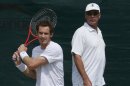 Andy Murray of Britain trains with his coach Ivan Lendl on a practise court at the Wimbledon Tennis Championships, in London