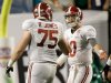 Alabama's AJ McCarron (10) and Barrett Jones argue during the second half of the BCS National Championship college football game against Notre Dame Monday, Jan. 7, 2013, in Miami. (AP Photo/David J. Phillip)