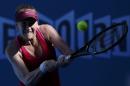 Madison Brengle of the U.S. hits a return against Coco Vandeweghe of the U.S. during their women's singles third round match at the Australian Open 2015 tennis tournament in Melbourne