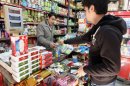 An Iranian man shops in a grocery in Tehran in 2010