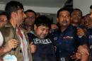 Bangladeshi property tycoon Sohel Rana (centre), seen wearing police-issue body armour, is escorted for his appearance in court in Dhaka on April 29, 2013