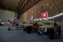 Reconnaissance aircrafts and military vehicles offered to Tunisia by the United States are seen at a military base in Tunis on May 12, 2016