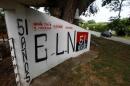 A graffiti, of rebel group Army Liberation National (ELN) is seen at the entrance of the cemetery of El Palo, Cauca, Colombia