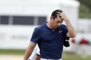 Rory McIlroy, of Northern Ireland, walks off after finishing the first round of the Cadillac Championship golf tournament, Thursday, March 3, 2016, in Doral, Fla. (AP Photo/Wilfredo Lee)