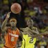 Michigan's Caris LeVert (23) passes the ball as Syracuse's C.J. Fair (5) looks on during the second half of the NCAA Final Four tournament college basketball semifinal game Saturday, April 6, 2013, in Atlanta. (AP Photo/David J. Phillip)