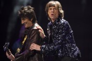 Ronnie Woods, left, and Mick Jagger of The Rolling Stones perform in concert on Saturday, Dec. 8, 2012 in New York. (Photo by Charles Sykes/Invision/AP)
