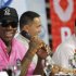 Former NBA Chicago Bulls player Dennis Rodman shares a light moment during a news conference inside a mall of Asia Arena in Manila