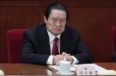 Former China's Politburo Standing Committee Member Zhou Yongkang attends the closing ceremony of the NPC in Beijing