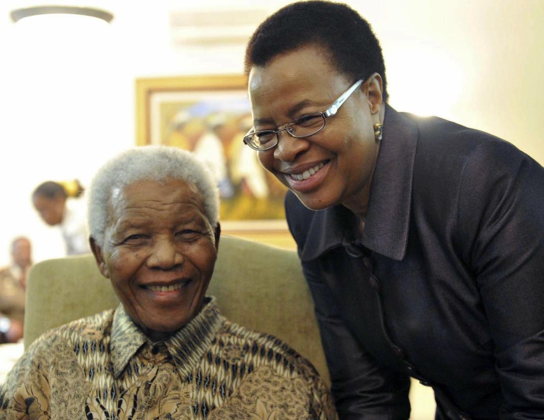 FILE - May 16, 2011 file photo supplied by the South African Government Communications and Information Services, GCIS, showing former South African President Nelson Mandela and his wife Graca Machel at his home in Johannesburg, South Africa. Mandela was admitted to a hospital on Saturday March 9 2013 for a scheduled medical check-up and doctors say there is no cause for
