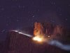 A floodlight illuminates a fire from a small plane crash in the Superstition Mountains in Apache Junction east of Phoenix, Wednesday, Nov. 23, 2011. Authorities said there was no apparent sign of survivors in the small twin-engine plane crash. (AP Photo/The Arizona Republic, Michael Schennum)  MARICOPA COUNTY OUT; MAGS OUT; TV OUT; NO SALES