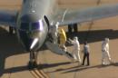 'Clipboard Man' Without a Hazmat Suit Attends Ebola Flight