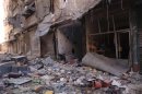 Damaged buildings are pictured in the Qastal al-Harami area, in Aleppo city after clashes between Free Syrian Army fighters and forces loyal to Syria's President Bashar al-Assad