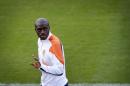 Bruno Martins Indi of the Netherlands waves at reporters from the field after a training session in which he did not participate, in Rio de Janeiro, Brazil, Friday, June 20, 2014. The Netherlands play in group B of the 2014 soccer World Cup. (AP Photo/Wong Maye-E)