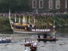 The royal barge Gloriana carries the Olympic flame in a cauldron on board, as it leaves Hampton Court Palace in London along the river Thames, on its way into central London on the final day of the Torch Relay, Friday, July 27, 2012. (AP Photo/Sang Tan)