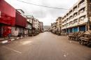 A usually busy street is deserted as Sierra Leone enters a three day country wide lockdown on movement of people due to the Ebola virus in the city of Freetown, Sierra Leone, Friday, March. 27, 2015. Sierra Leone's 6 million people were told to stay home for three days, except for religious services, beginning Friday as the West African nation attempted a final push to rid itself of Ebola. (AP Photo/ Michael Duff)