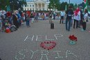 Demonstrators calling for help from US President Obama for Syria, protest in front of the White House August 21, 2013