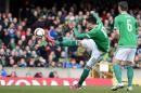 Northern Ireland's Kyle Lafferty scores against Finland during the Euro 2016 qualifier soccer match at Windsor Park, Belfast, Sunday March 29, 2015. (AP Photo/PA, Martin Rickett) UNITED KINGDOM OUT NO SALES NO ARCHIVE