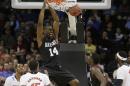 Harvard's Steve Moundou-Missi (14) dunks against Cincinnati in the second half during the second-round of the NCAA men's college basketball tournament in Spokane, Wash., Thursday, March 20, 2014. (AP Photo/Young Kwak)