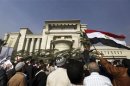 Supporters of Egyptian President Mohamed Mursi shout slogans in front of the Supreme Constitutional Court in Maadi