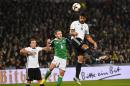 Germany's Sami Khedira, right, heads for the ball in front of Northern Ireland's Lee Hodson, center, and Germany's Mario Goetze, left, during the World Cup Group C qualifying soccer match between Germany and Northern Ireland in Hannover, Germany, Tuesday, Oct. 11, 2016. (AP Photo/Martin Meissner)