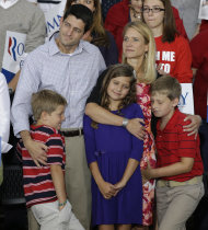 Vice presidential running mate Rep. Paul Ryan, R-Wis,left, his wife Janna and daughter Liza and sons Charles, and Sam, right, during a welcome home rally Sunday, August, 12, 2012 in Waukesha, Wis. (AP Photo/Jeffrey Phelps)