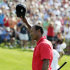 Tiger Woods waves to the crowd after making a birdie putt on the 18th hole during the final round of the Memorial golf tournament, Sunday, June 3, 2012, in Dublin, Ohio. Woods birdied three of his last four holes to win the Memorial and match tournament host Jack Nicklaus with his 73rd title on the PGA Tour. (AP Photo/Jay LaPrete)