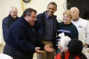 President Barack Obama, center, and Federal Emergency Management (FEMA) administrator Craig Fugate, left, watch as New Jersey Gov. Chris Christie, second from left, meets with local residents at Brigantine Beach Community Center, Wednesday, Oct. 31, 2012, in Brigantine, NJ. Obama traveled to Atlantic Coast to see first-hand the relief efforts after Superstorm Sandy damage the Atlantic Coast. (AP Photo/Pablo Martinez Monsivais)