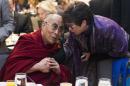 Valerie Jarrett, senior adviser to President Barack Obama, right, talks with the Dalai Lama during the National Prayer Breakfast in Washington, Thursday, Feb. 5, 2015. The annual event brings together U.S. and international leaders from different parties and religions for an hour devoted to faith. (AP Photo/Evan Vucci)
