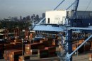 Containers await departure as crews load and unload consumer products at the Port of New Orleans along the Mississippi River in New Orleans, Louisiana