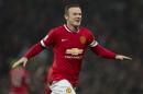 Manchester United's Wayne Rooney celebrates after scoring during the English Premier League soccer match between Manchester United and Hull City at Old Trafford Stadium, Manchester, England, Saturday Nov. 29, 2014. (AP Photo/Jon Super)