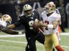 San Francisco 49ers quarterback Colin Kaepernick (7) scrambles as New Orleans Saints defensive end Cameron Jordan (94) pursues in the first half of an NFL football game at the Louisiana Superdome in New Orleans, Sunday, Nov. 25, 2012. (AP Photo/Bill Haber)