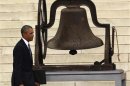 US President Obama walks past church bell before speaking at the Lincoln Memorial in Washington