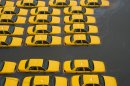 A parking lot full of yellow cabs is flooded as a result of superstorm Sandy on Tuesday, Oct. 30, 2012 in Hoboken, NJ. (AP Photo/Charles Sykes)