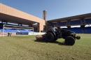 An employee cuts the grass on October 20, 2014 at the Marrakesh Stadium in the southern Moroccan city