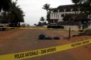 A police cordon is seen around the hotel Etoile du Sud following an attack by gunmen from al Qaeda's North African branch, in Grand Bassam