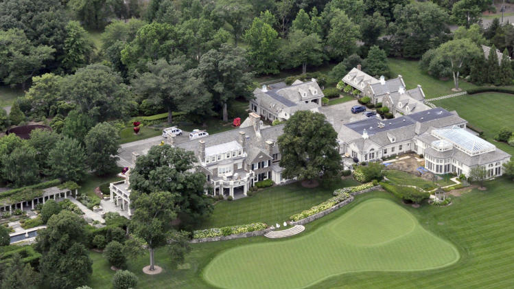 FILE -This Friday, July 26, 2013, file photo shows the Greenwich, Conn. estate belonging to billionaire hedge fund owner Stephen Cohen, Cohen's company, hedge fund giant SAC Capital Advisors agreed Monday, Nov. 4, 2013, to plead guilty to fraud charges and to pay a $1.8 billion financial penalty. (AP Photo/Vincent T. Vuoto, File)
