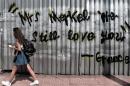 A graffito in central Athens on June 19, 2015 reads "Mrs Merkel we still love you - Greece"