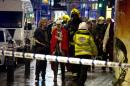 A woman stands bandaged and wearing a blanket given by emergency services following an incident at the Apollo Theatre, in London's Shaftesbury Avenue, Thursday evening, Dec. 19, 2013, during a performance at the height of the Christmas season, with police saying there were "a number" of casualties. It wasn't immediately clear if the roof, ceiling or balcony had collapsed during a performance. Police said they "are aware of a number of casualties," but had no further details. (AP Photo by Joel Ryan, Invision)