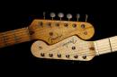 An original 1954 Fender Stratocaster head stock, left, is shown next to a 2014 model, Friday, Jan. 10, 2014 at a studio in Scottsdale, Ariz. April 2014 marks the 60th anniversary of the very first Stratocaster ever sold. (AP Photo/Matt York)