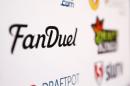 A FanDuel logo is displayed on a board inside of the DFS Players Conference in New York