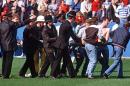 A football fan is carried from the pitch at Hillsborough stadium in Sheffield following a crush in the stands on April 15, 1989