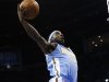 Denver Nuggets guard Ty Lawson (3) shoots in front of Oklahoma City Thunder forward Nick Collison (4) in the second quarter of an NBA basketball game in Oklahoma City, Tuesday, March 19, 2013. (AP Photo/Sue Ogrocki)